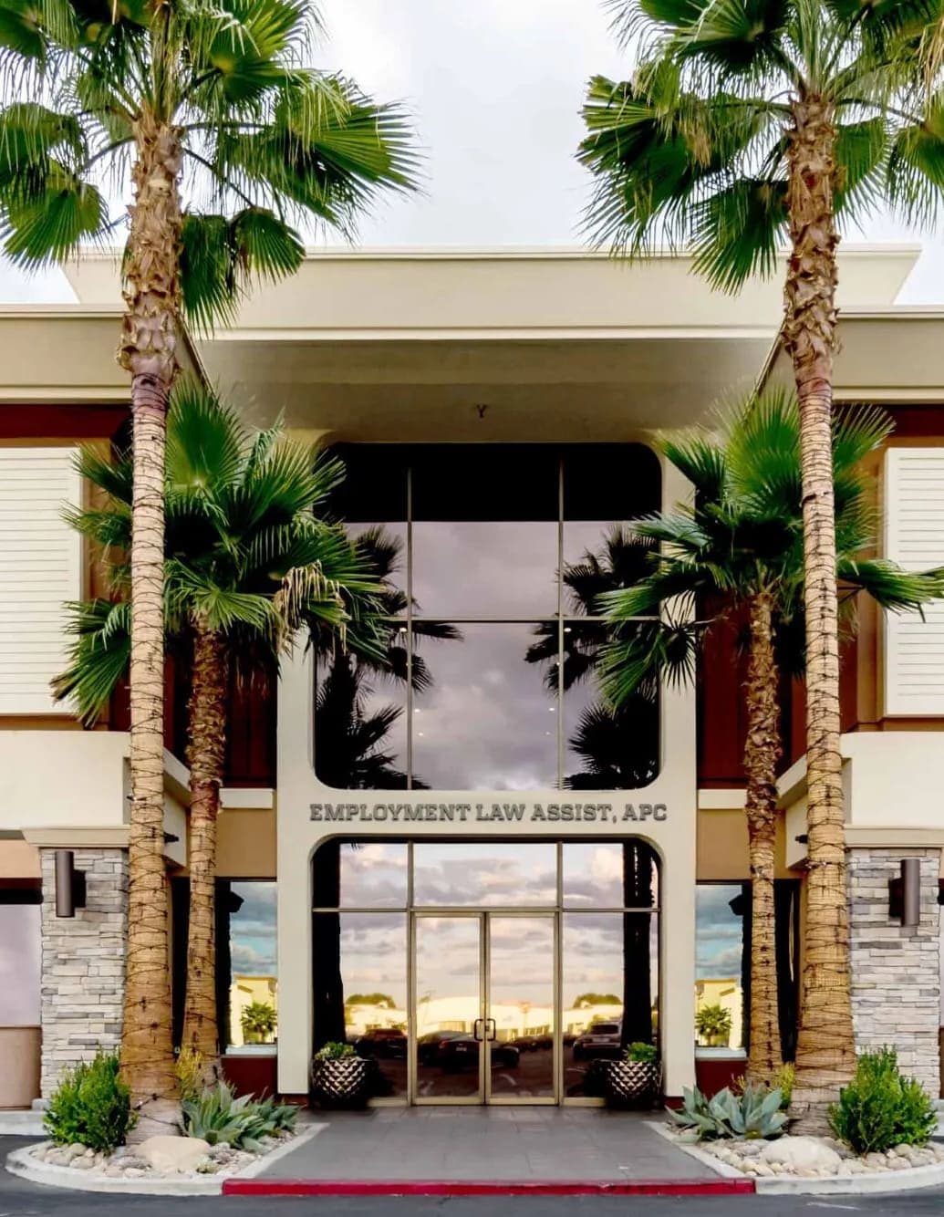 The Employment Law Assist, APC building entrance on Ventura Boulevard, framed by palm trees